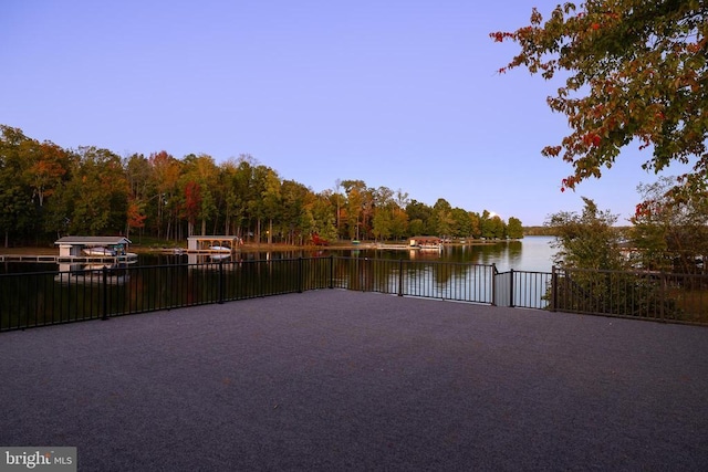 235 Sir Walter Dr, Bumpass, VA 23024 - water view featuring a wooded view, fence, and a gate