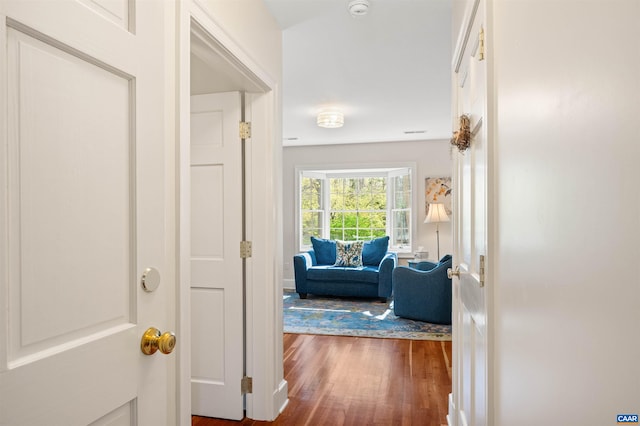 corridor featuring dark wood-style floors