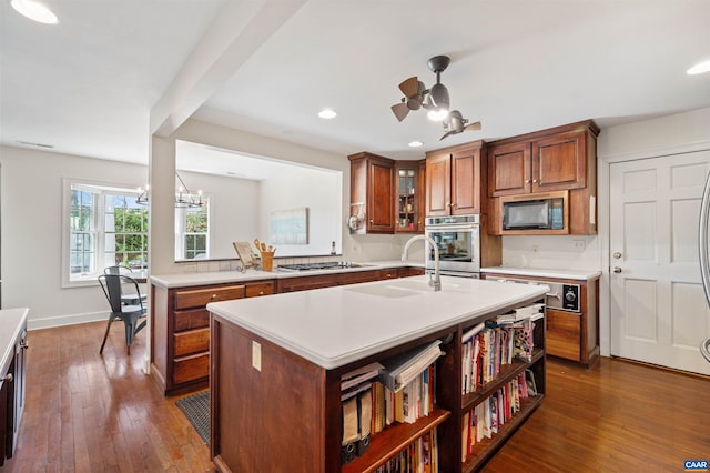 kitchen with recessed lighting, light countertops, appliances with stainless steel finishes, and a sink