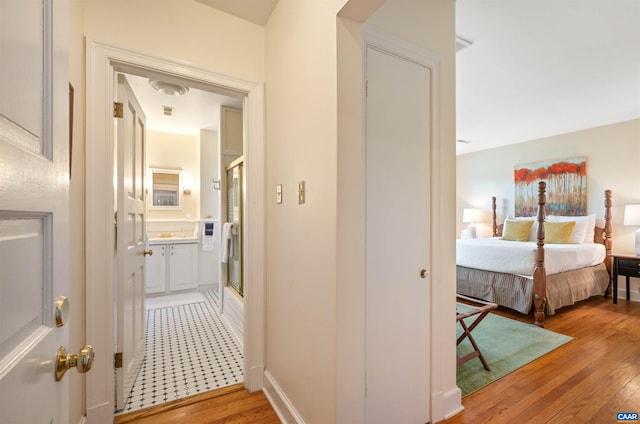 hallway featuring light wood-type flooring