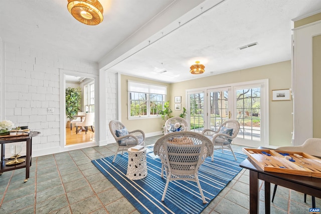 sunroom with french doors and visible vents