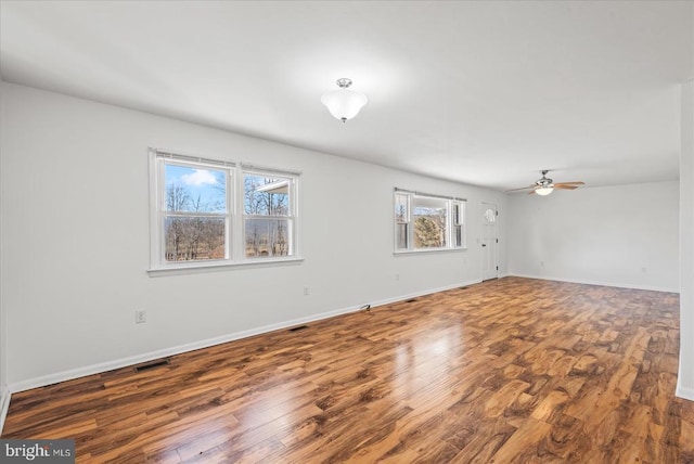 6054 Ridgeview Rd, Madison, VA 22727 - empty room with wood finished floors, a ceiling fan, and baseboards