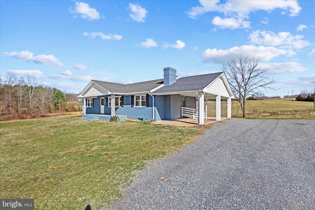 6054 Ridgeview Rd, Madison, VA 22727 - ranch-style house with covered porch, gravel driveway, a chimney, and a front lawn