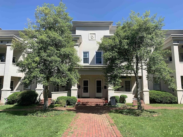 1311 N Augusta St Unit 6, Staunton, VA 24401 - view of front of house with stucco siding and a front lawn