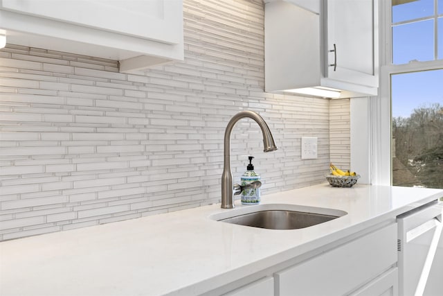 1311 N Augusta St Unit 6, Staunton, VA 24401 - kitchen featuring decorative backsplash, a sink, light countertops, white cabinets, and white dishwasher