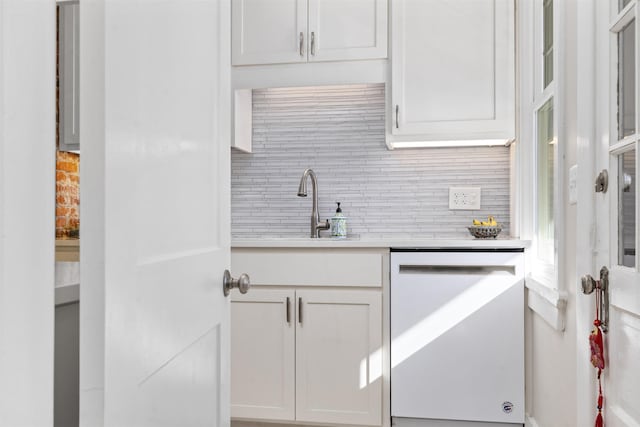 1311 N Augusta St Unit 6, Staunton, VA 24401 - kitchen with white dishwasher, tasteful backsplash, light countertops, white cabinets, and a sink