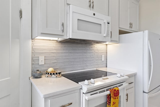 1311 N Augusta St Unit 6, Staunton, VA 24401 - kitchen with white appliances, tasteful backsplash, light countertops, and white cabinetry