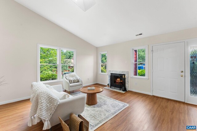 941 Warwick Ct, Charlottesville, VA 22901 - living area with wood finished floors, a high end fireplace, and lofted ceiling