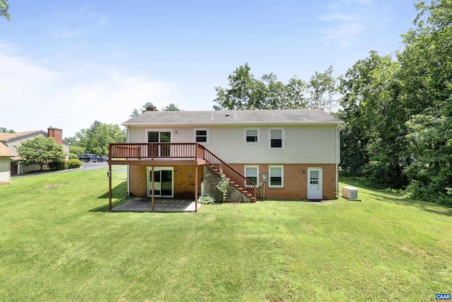 2612 Lawrence Rd, Charlottesville, VA 22901 - back of property featuring brick siding, stairway, a deck, a yard, and a chimney