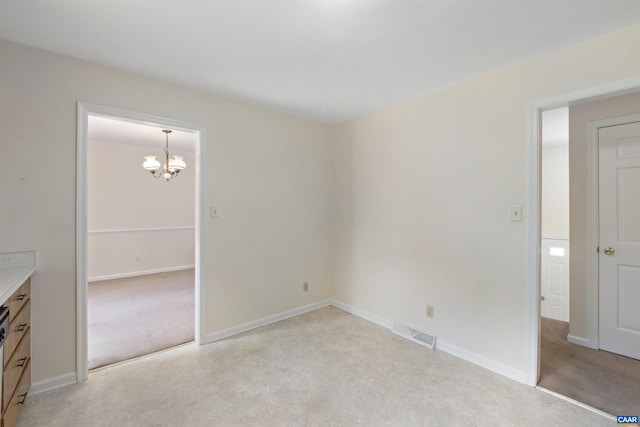 2612 Lawrence Rd, Charlottesville, VA 22901 - spare room with light colored carpet and a chandelier