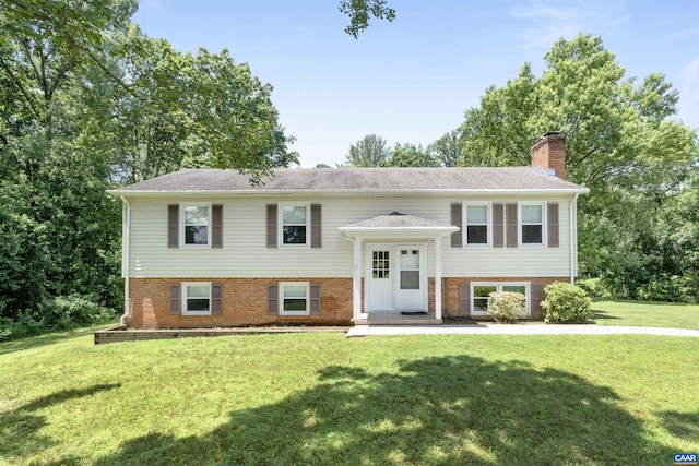 2612 Lawrence Rd, Charlottesville, VA 22901 - bi-level home featuring a front yard, brick siding, and a chimney