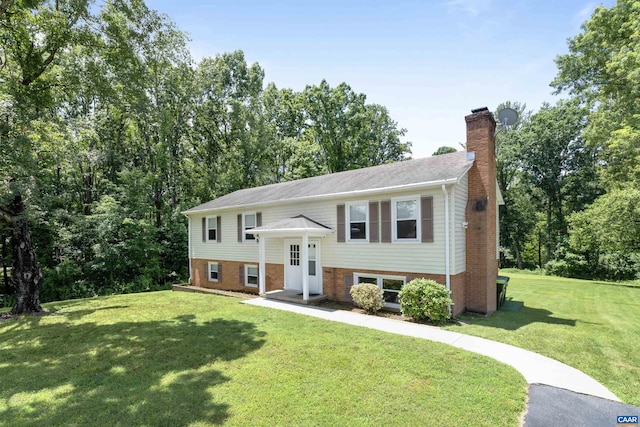 2612 Lawrence Rd, Charlottesville, VA 22901 - bi-level home with brick siding, a chimney, and a front lawn