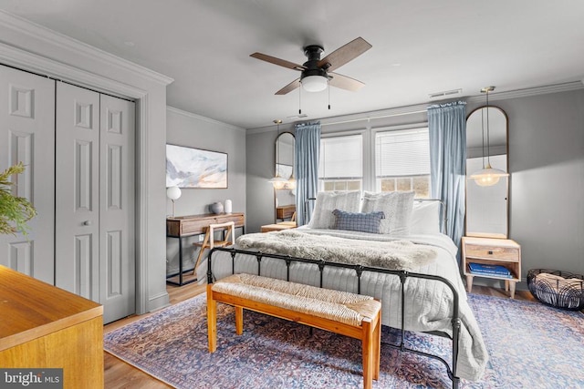 1195 Quaker Run Rd, Madison, VA 22727 - bedroom with wood finished floors, ornamental molding, ceiling fan, and a closet
