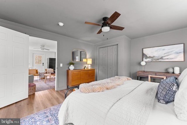 1195 Quaker Run Rd, Madison, VA 22727 - bedroom featuring wood finished floors, crown molding, a closet, baseboards, and a ceiling fan