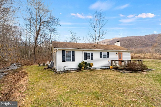 1195 Quaker Run Rd, Madison, VA 22727 - back of house featuring a deck with mountain view, a chimney, and a lawn