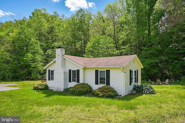 1195 Quaker Run Rd, Madison, VA 22727 - view of side of home featuring a chimney, a lawn, roof with shingles, and a view of trees