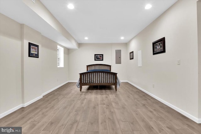 bedroom with recessed lighting, baseboards, and light wood-style flooring
