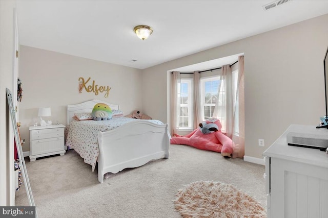 bedroom with light carpet, baseboards, and visible vents