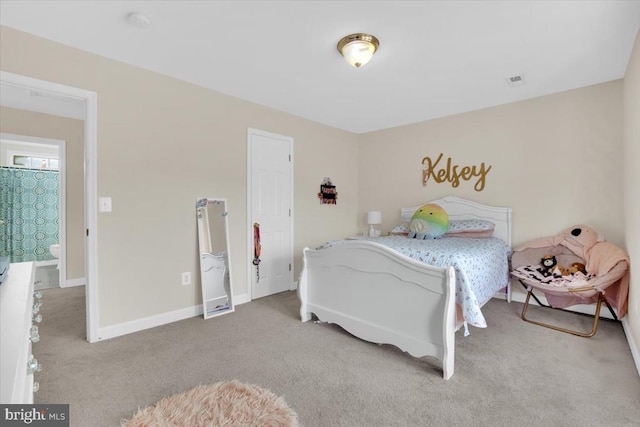 carpeted bedroom with baseboards