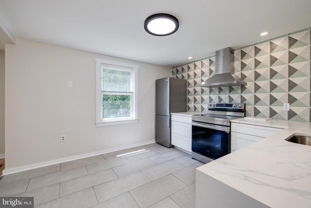 102 Hawksbill St S, Luray, VA 22835 - kitchen featuring stainless steel appliances, wall chimney range hood, light stone counters, decorative backsplash, and white cabinetry