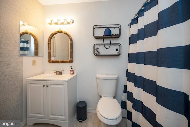 200 Wilderness Ln, Locust Grove, VA 22508 - full bathroom with baseboards, vanity, toilet, and tile patterned flooring