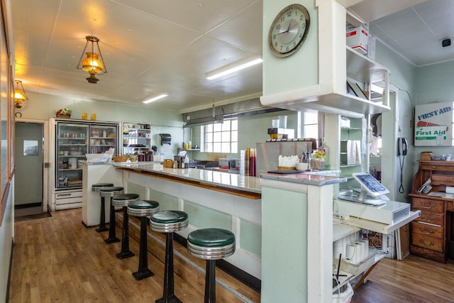 222 Main St, Dayton, VA 22821 - kitchen featuring wood finished floors and a kitchen bar