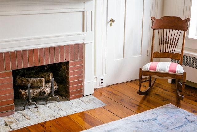 222 Main St, Dayton, VA 22821 - living area with a fireplace, radiator, and wood finished floors