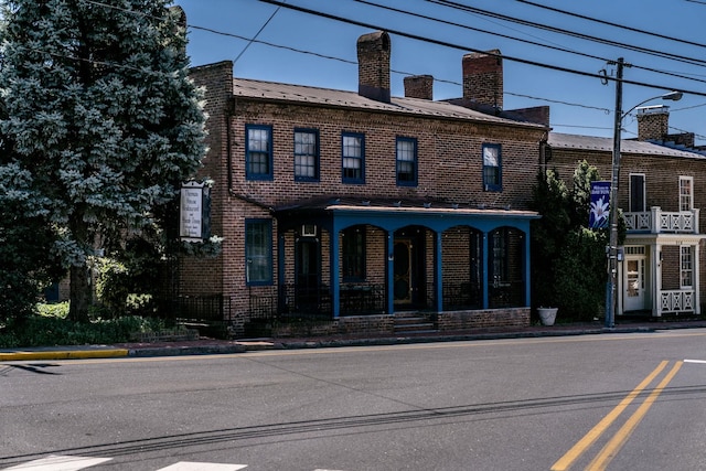 222 Main St, Dayton, VA 22821 - view of front of property with a chimney, a porch, and brick siding