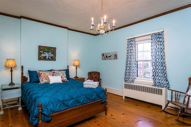 222 Main St, Dayton, VA 22821 - bedroom with radiator, hardwood / wood-style flooring, ornamental molding, a chandelier, and baseboards