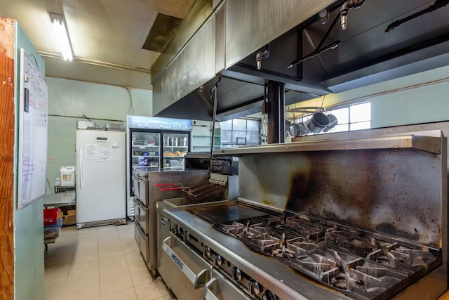 222 Main St, Dayton, VA 22821 - kitchen with stainless steel gas range and freestanding refrigerator