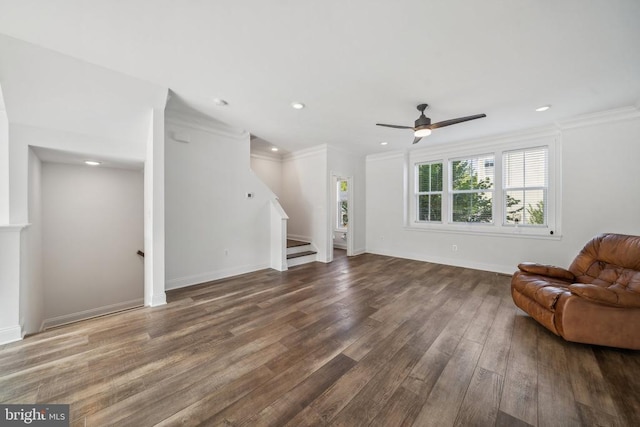 living room featuring crown molding, stairway, wood finished floors, a ceiling fan, and recessed lighting