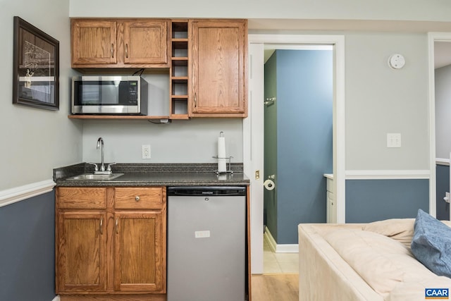 100 Melbourne Prk Cir Unit B, Charlottesville, VA 22901 - kitchen featuring dishwashing machine, stainless steel microwave, open shelves, dark countertops, and brown cabinets