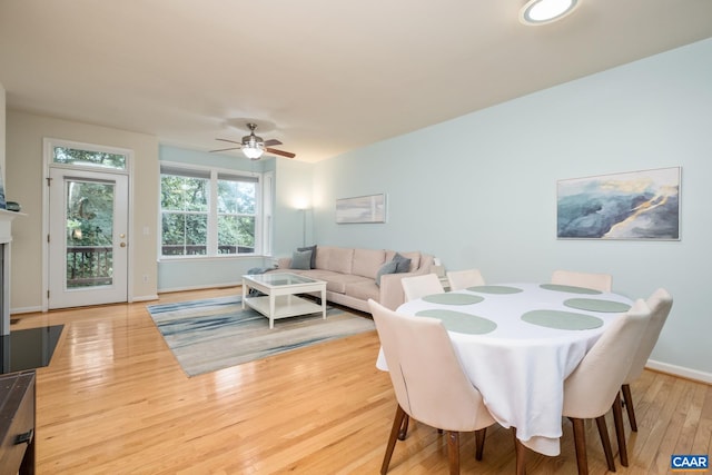 100 Melbourne Prk Cir Unit B, Charlottesville, VA 22901 - dining room with wood finished floors, ceiling fan, and a fireplace