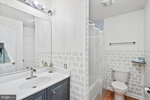 2211 Rock Creek Rd, Fredericksburg, VA 22407 - bathroom featuring vanity, toilet, wood finished floors, tile walls, and curtained shower