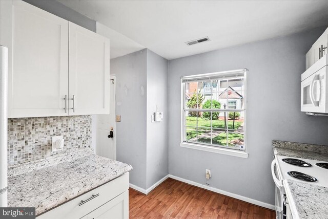 2211 Rock Creek Rd, Fredericksburg, VA 22407 - kitchen with white appliances, light wood finished floors, tasteful backsplash, and white cabinetry