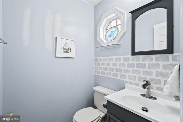 2211 Rock Creek Rd, Fredericksburg, VA 22407 - half bath featuring tasteful backsplash, toilet, and vanity