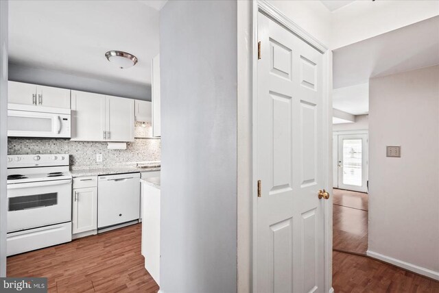 2211 Rock Creek Rd, Fredericksburg, VA 22407 - kitchen with white appliances, white cabinetry, light countertops, and wood finished floors