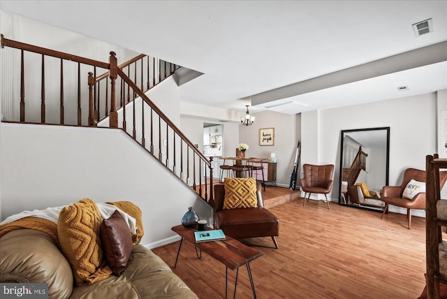 2211 Rock Creek Rd, Fredericksburg, VA 22407 - living area featuring wood finished floors, stairway, a chandelier, and baseboards