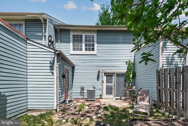 2211 Rock Creek Rd, Fredericksburg, VA 22407 - back of property featuring central AC unit and fence