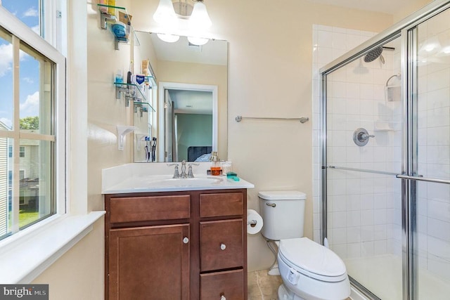  - full bath featuring a shower stall, plenty of natural light, and vanity