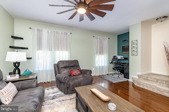  - living room featuring healthy amount of natural light, a desk, wood finished floors, and ceiling fan