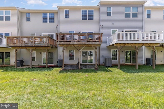  - back of house with a yard and a deck