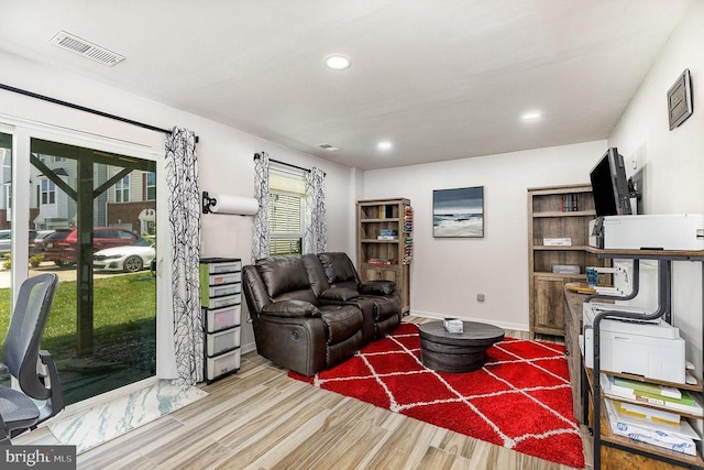  - living room with wood finished floors and recessed lighting