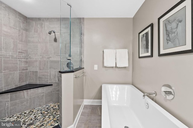325 Oneals Rd, Madison, VA 22727 - bathroom with a soaking tub, baseboards, and a walk in shower