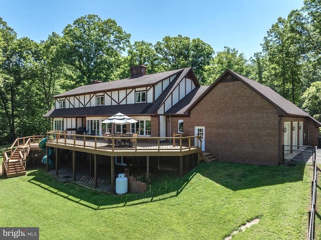 325 Oneals Rd, Madison, VA 22727 - back of house with a wooden deck, stairs, brick siding, and a lawn