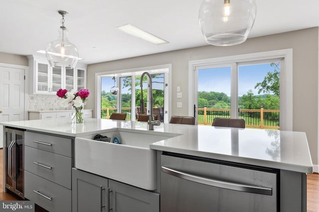 325 Oneals Rd, Madison, VA 22727 - kitchen featuring dishwasher, a sink, gray cabinetry, light countertops, and wood finished floors