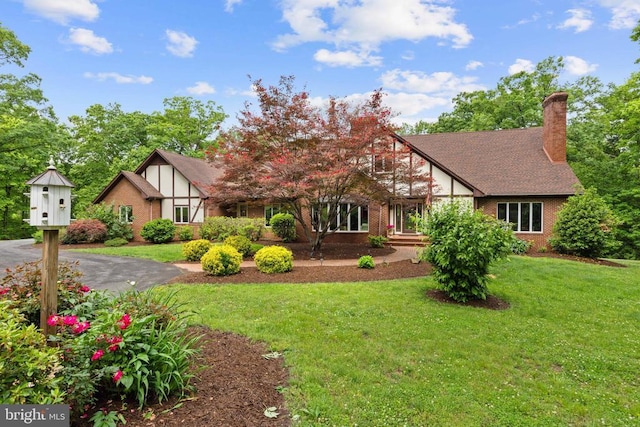 325 Oneals Rd, Madison, VA 22727 - tudor house featuring a front yard, brick siding, and a chimney