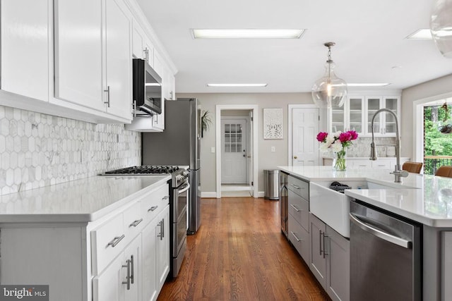 325 Oneals Rd, Madison, VA 22727 - kitchen featuring appliances with stainless steel finishes, a sink, light countertops, decorative backsplash, and white cabinetry