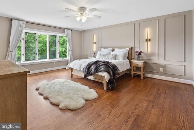 325 Oneals Rd, Madison, VA 22727 - bedroom featuring baseboards, wood finished floors, a decorative wall, and a ceiling fan