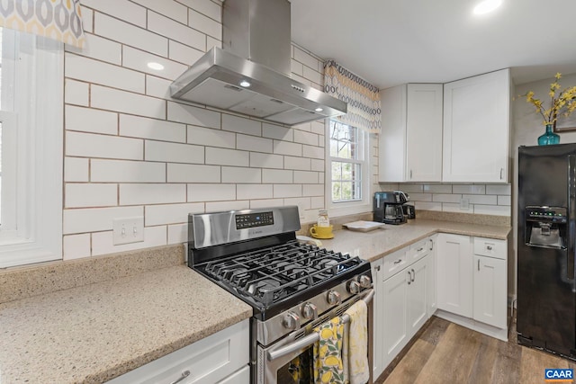 330 Carrsbrook Dr, Charlottesville, VA 22901 - kitchen with stainless steel gas stove, wall chimney exhaust hood, black refrigerator with ice dispenser, and white cabinetry